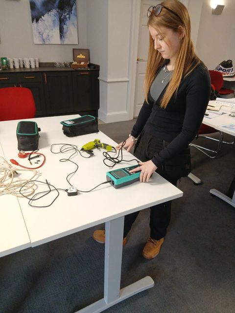 Learner carrying out a PAT test
